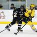 Michigan sophomore left wingman Alex Guptill competes for the puck in the third period of the game against Western Michigan on Saturday. Daniel Brenner I AnnArbor.com